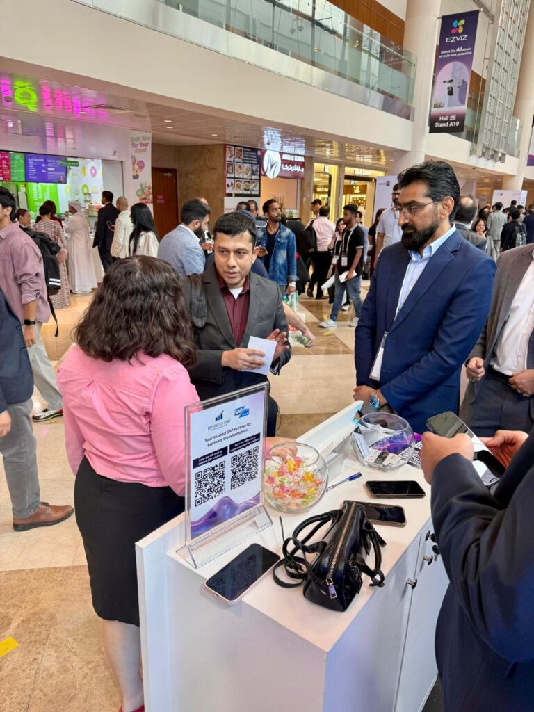 Ali Mustafa Country Head Iraq at Business Line SAP Solution provider company talking to his team and a visitor in Gitex global 2025